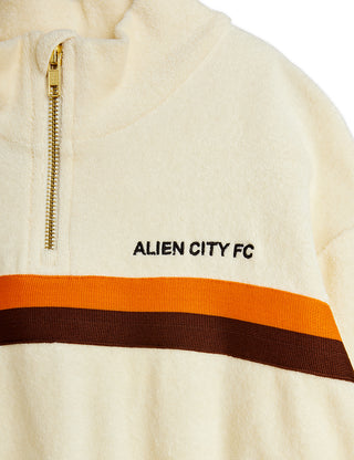 Close up of Alien City FC half zip terry sweatshirt from Mini Rodini rented on Bundle to Bundle
