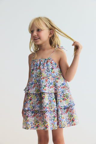 6 year old girl wearing the new society's Verbena Dress Verbena Print rented from a kids clothing rental subscription - Bundle to Bundle