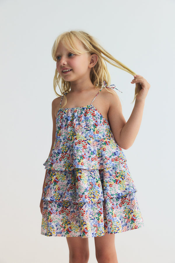 6 year old girl wearing the new society's Verbena Dress Verbena Print rented from a kids clothing rental subscription - Bundle to Bundle