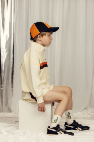 7 Year old boy wearing Alien City FC half zip terry sweatshirt from Mini Rodini rented on Bundle to Bundle
