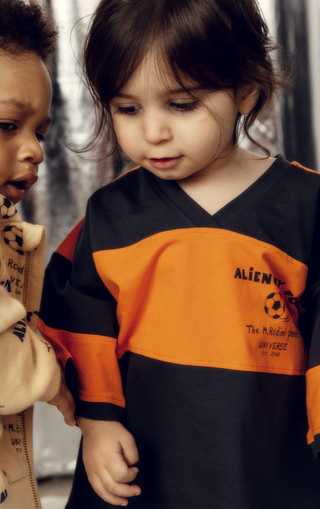 little boy wearing mini rodini rugby shirt from bundle to bundle a kids rental clothing company