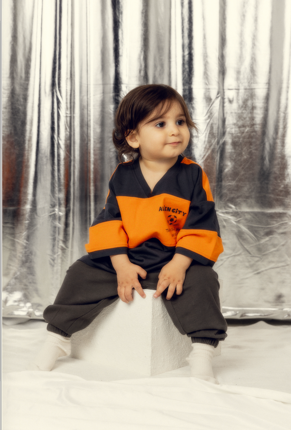 Toddler boy wearing mini rodini from bundle to bundle a kids rental clothing company